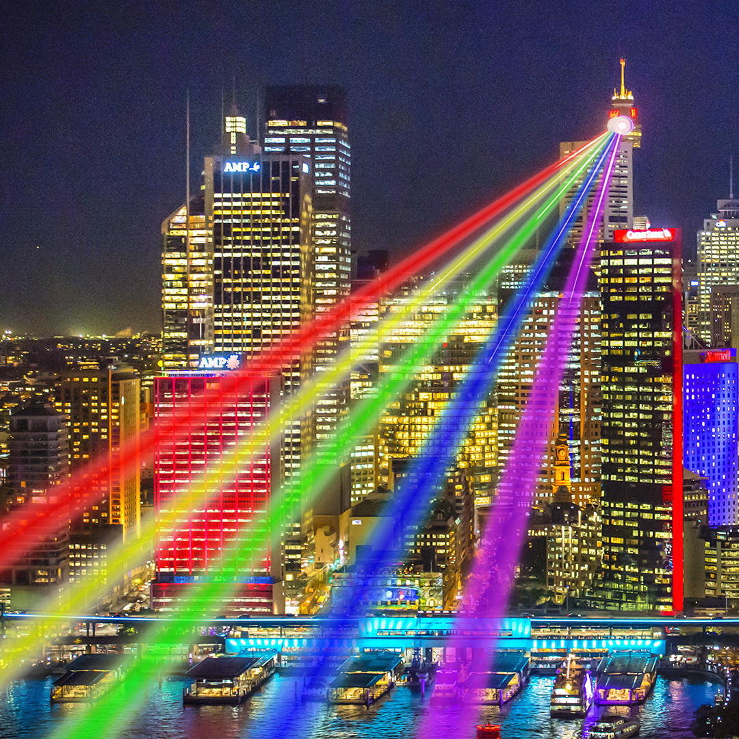 An impression of the rainbow coloured 40km-long laser beams to be projected from the Sydney Tower