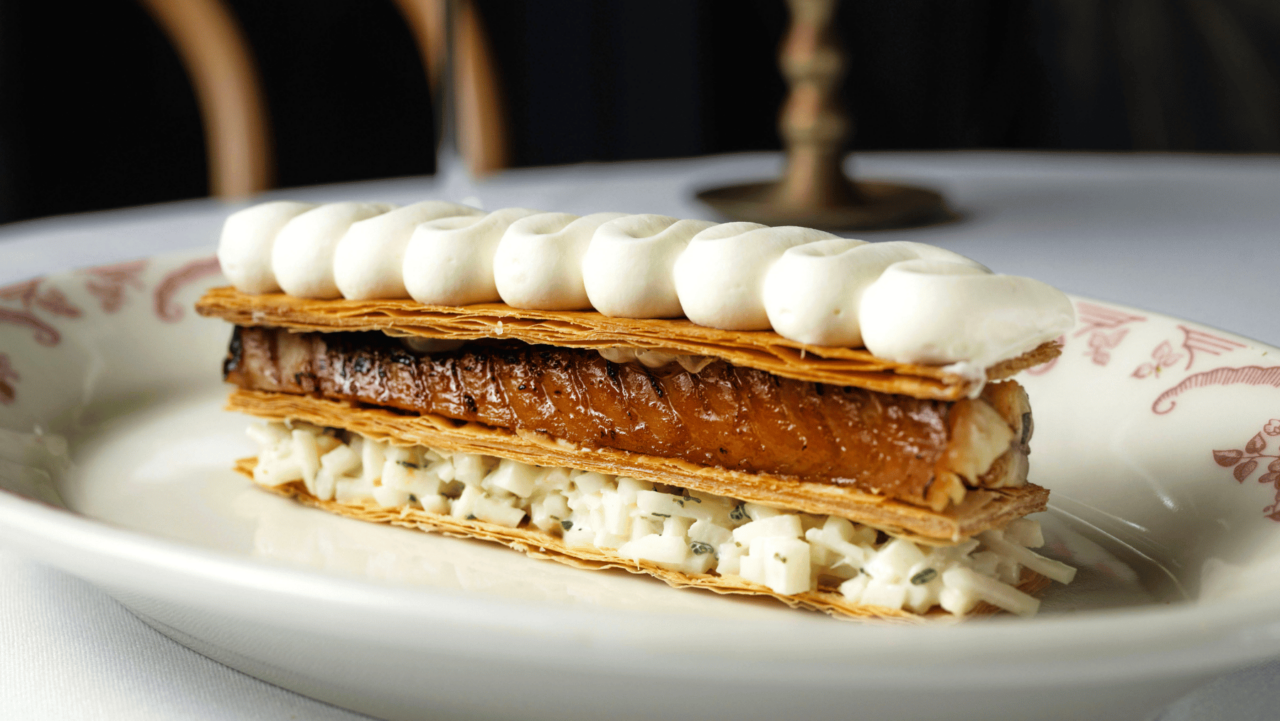 A mille-feuille rests on a plate