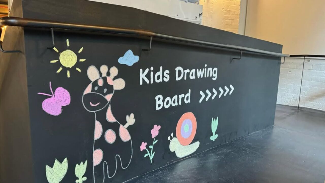 Kids are encouraged to draw on the Three Williams drawing board.