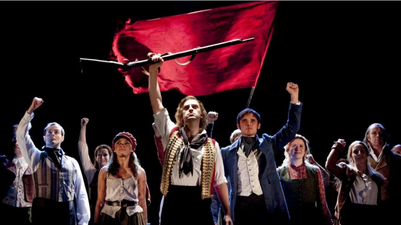 a group of people holding a gun