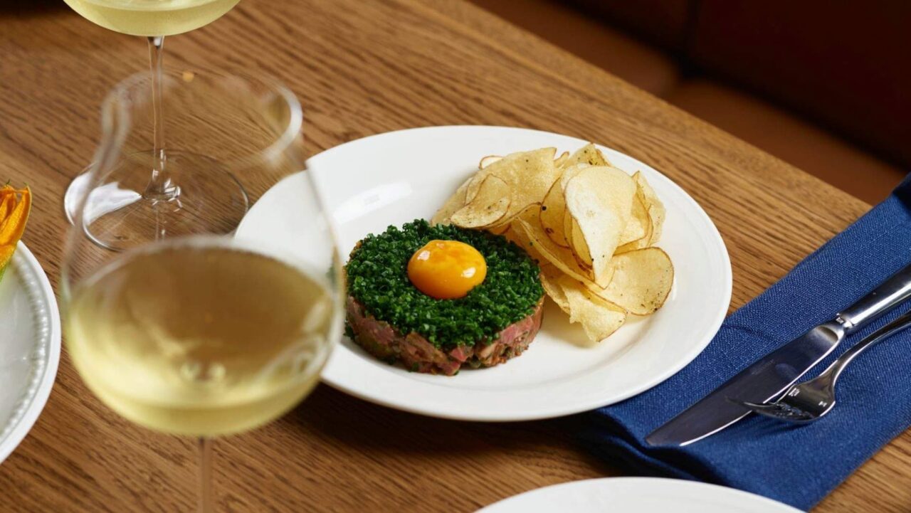 Beef tartare, topped with a yolk and herbs