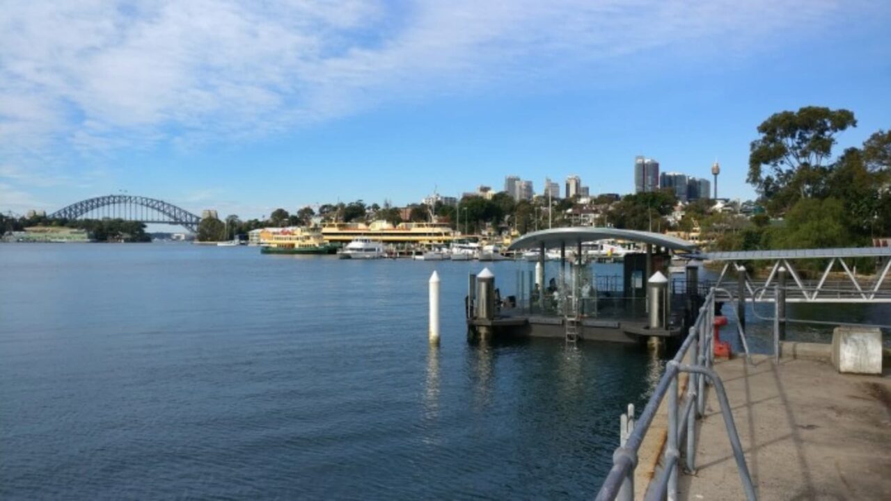 A ferry wharf sits on the water, awaiting arrival