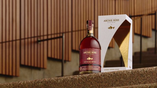 A bottle of whisky sitting on the Sydney Opera House steps