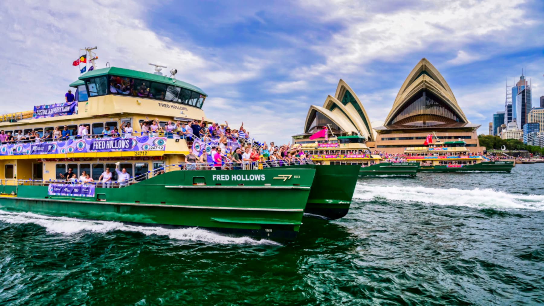 A ferry on Sydney Harbour with the Sydney Opera House in the background.