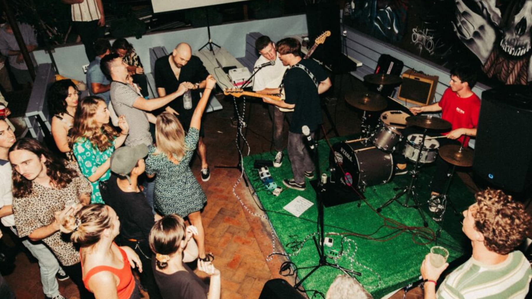 Young people partying in a band room.