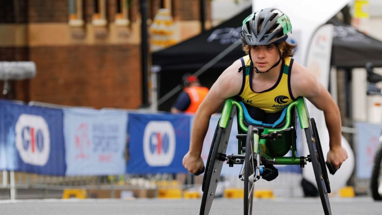 An athlete in a wheelchair racing on Australia Day in Sydney