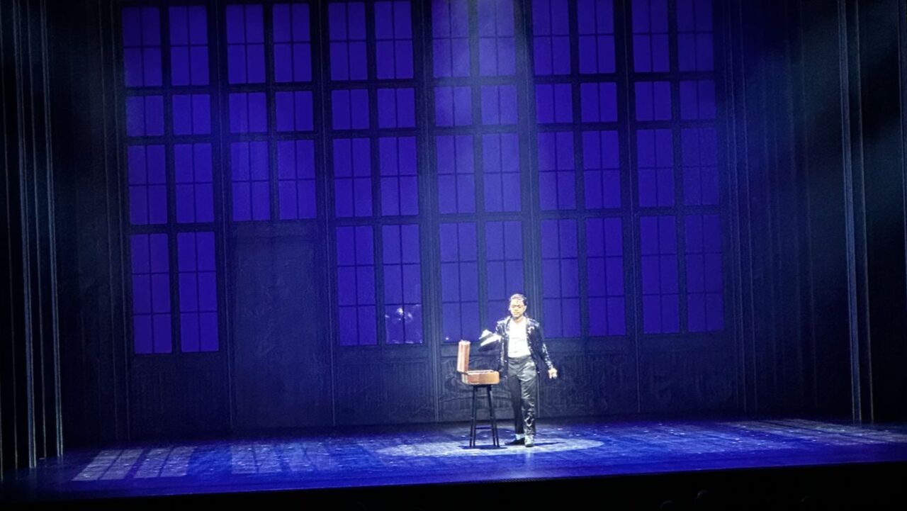 Michael Jackson onstage under the spotlight in MJ the Musical