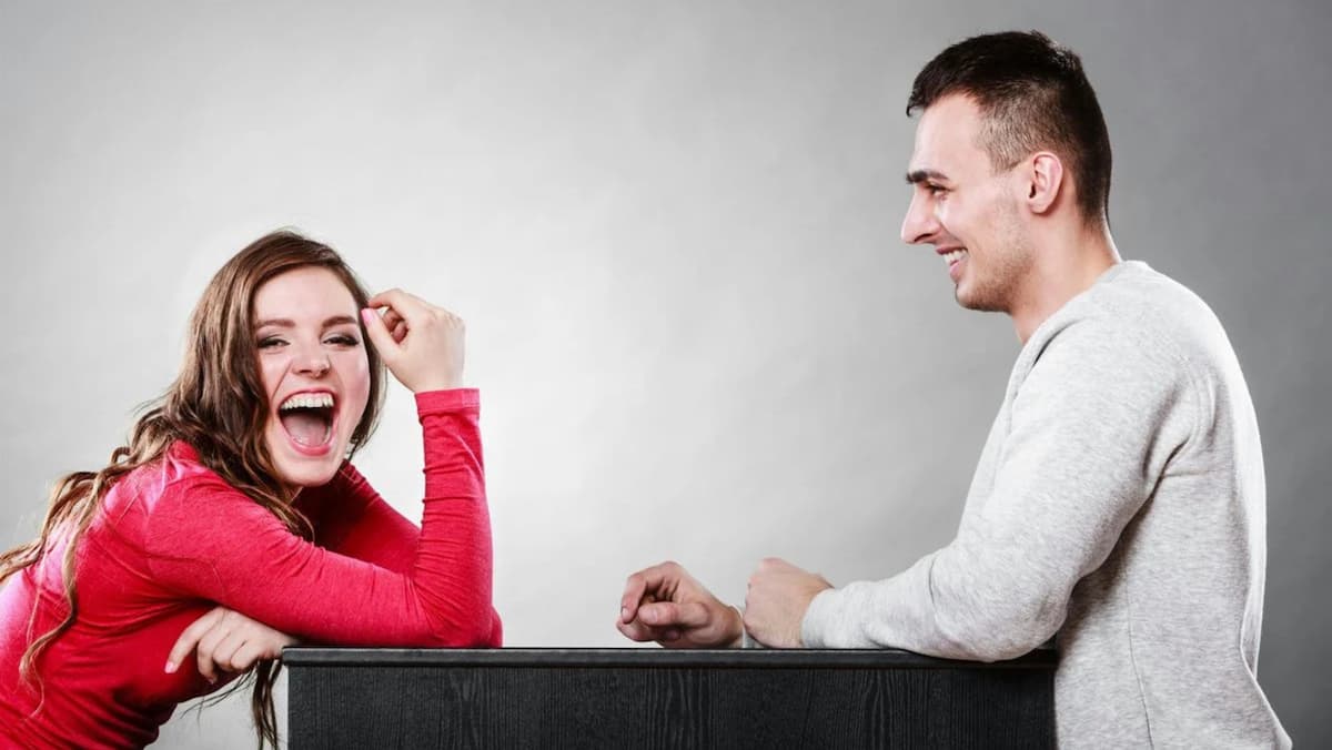 Two people at a speed dating event.