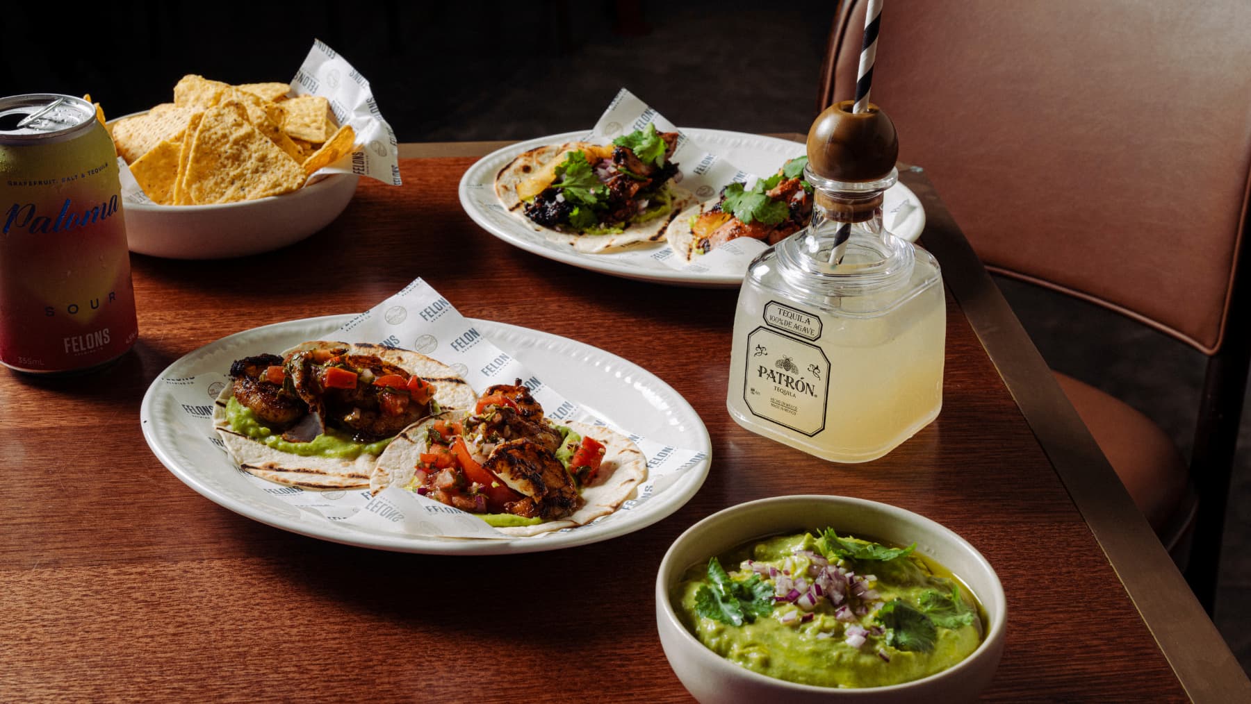 A bottle of Tequila and Mexican food
