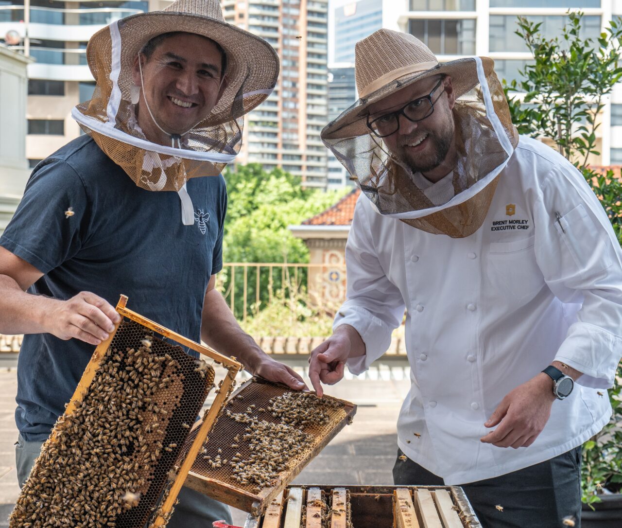 Rooftop Bees' founder John Prince (left) and executive chef Brent Morley (right) work together to look after and showcase the hotel's rooftop beehives.