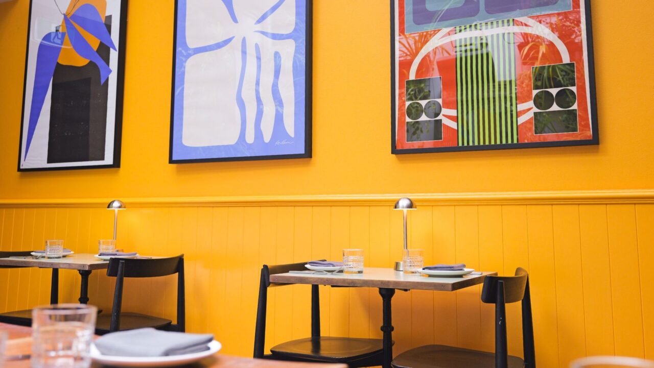 Bursting with warmth, there are no dark, dingy corners at tqm., Sydney's new South American restaurant where retro artworks adorn the golden walls.