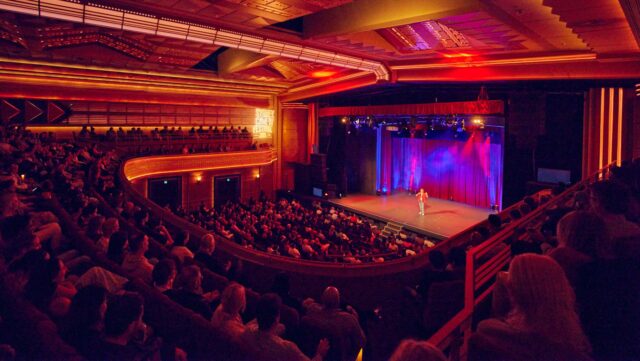 a stage with a crowd of people watching