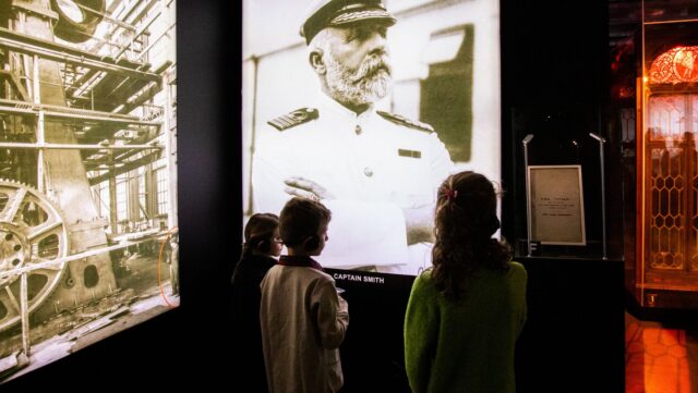 Three children are pictured at Titanic: The Human Story, an interactive exhibition coming to Sydney on Friday, May 30.