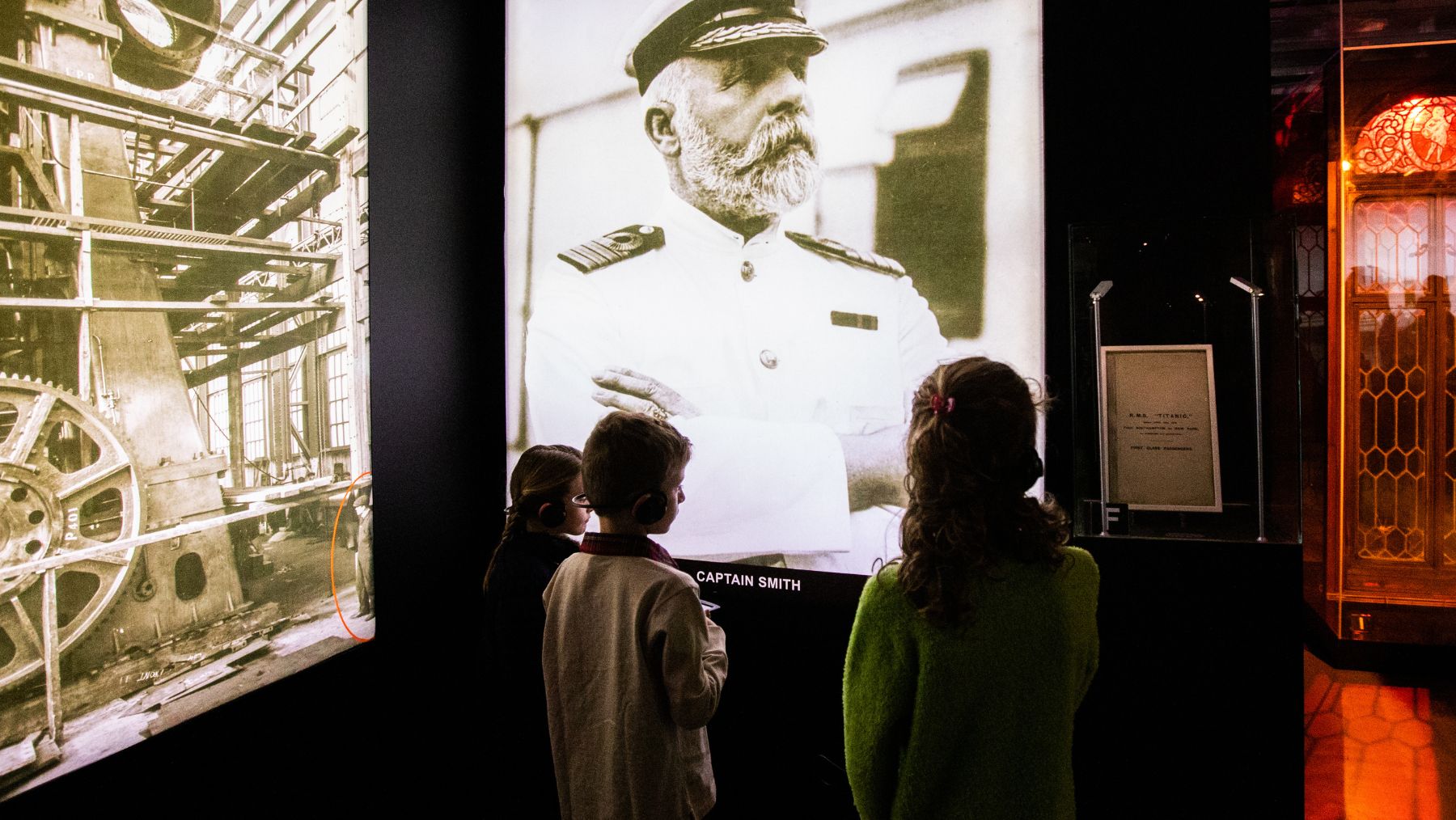 Three children are pictured at Titanic: The Human Story, an interactive exhibition coming to Sydney on Friday, May 30.