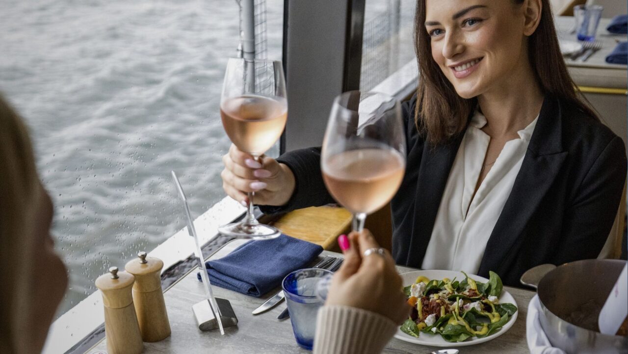 Young woman on lunchtime Sydney Harbour cruise