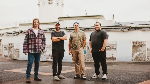 a group of men standing outside