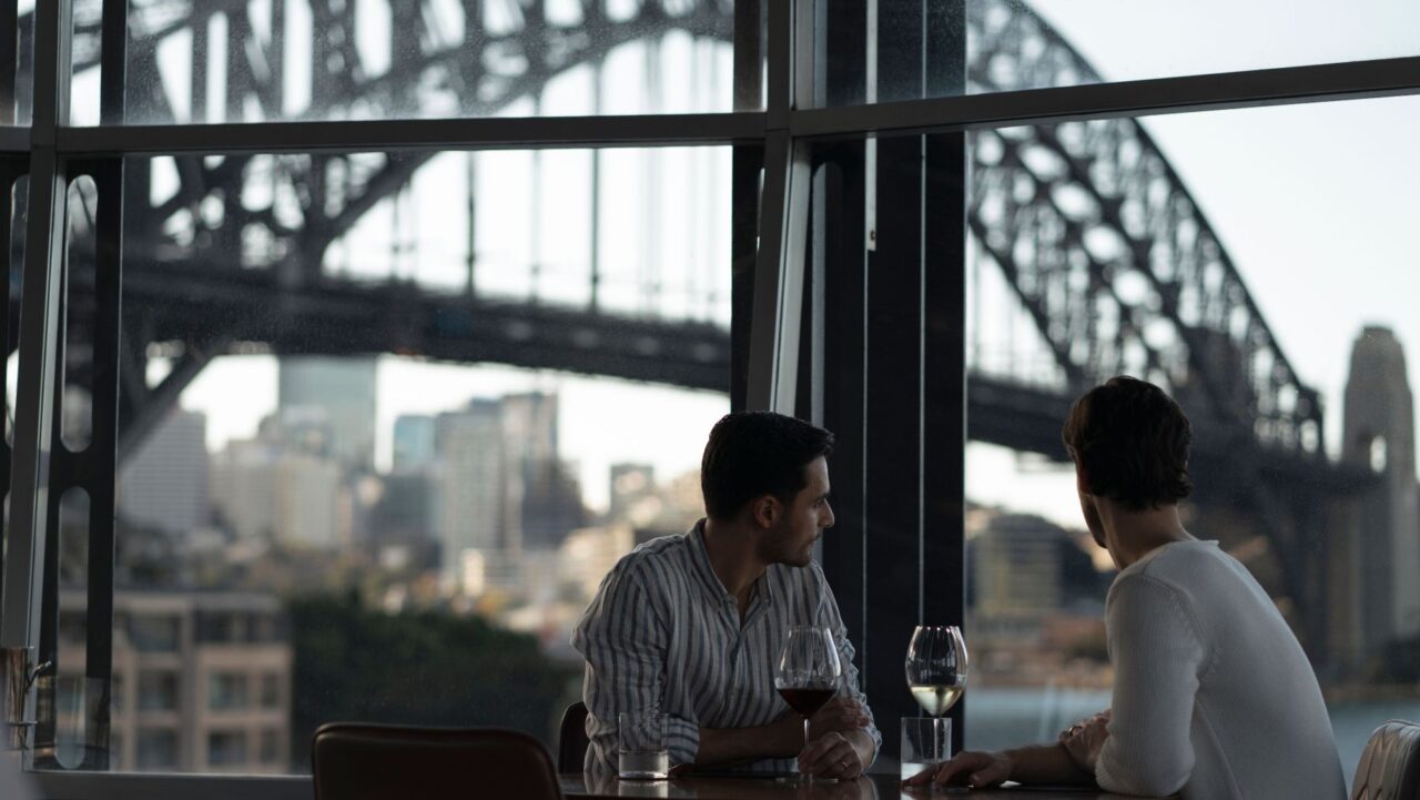 Couple at Quay Restaurant with Sydney Harbour Bridge view