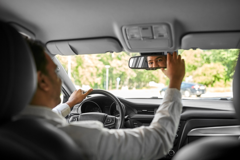 Taxi Driver looking into a mirror