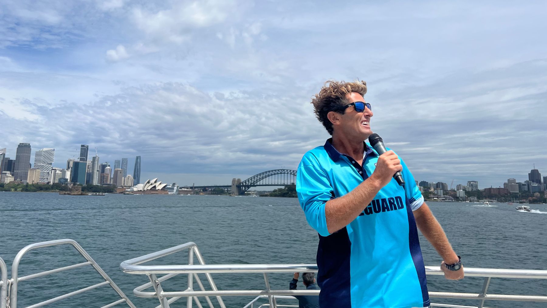 Harries Bondi Rescue in front of the Sydney Opera House and harbour bridge