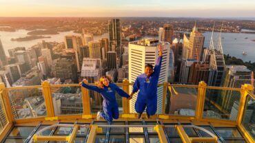 Merlin Attractions Hero Image, two people jump on a tower