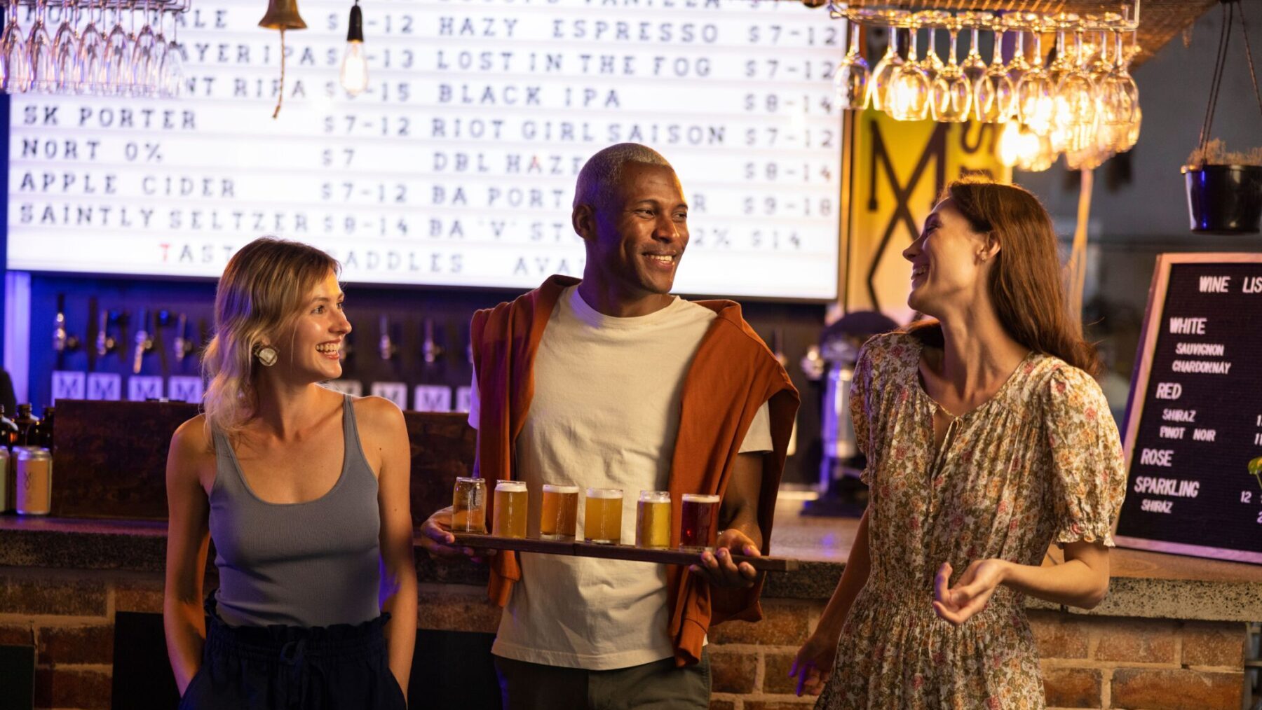 Best breweries in Sydney. Friends ordering a beer tasting paddle at Modus Operandi Brewing Company, Mona Vale.