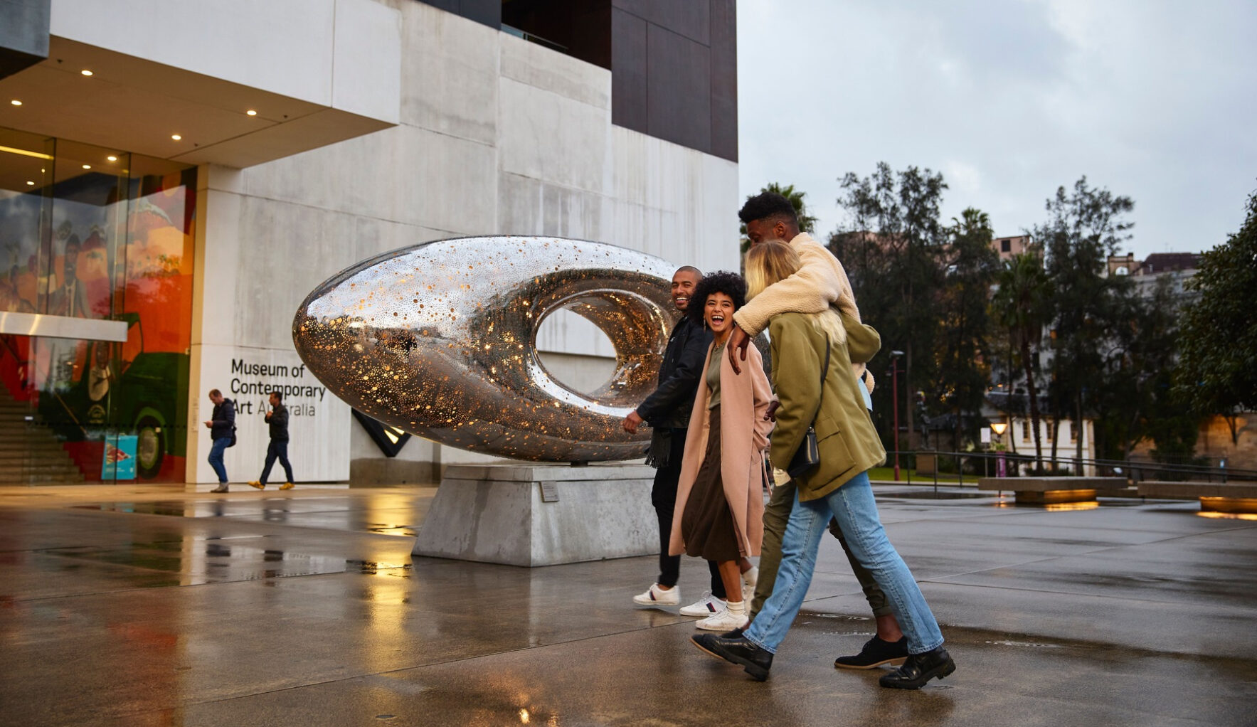 People walk to Museum of Contemporary Art where there is admission price in Sydney
