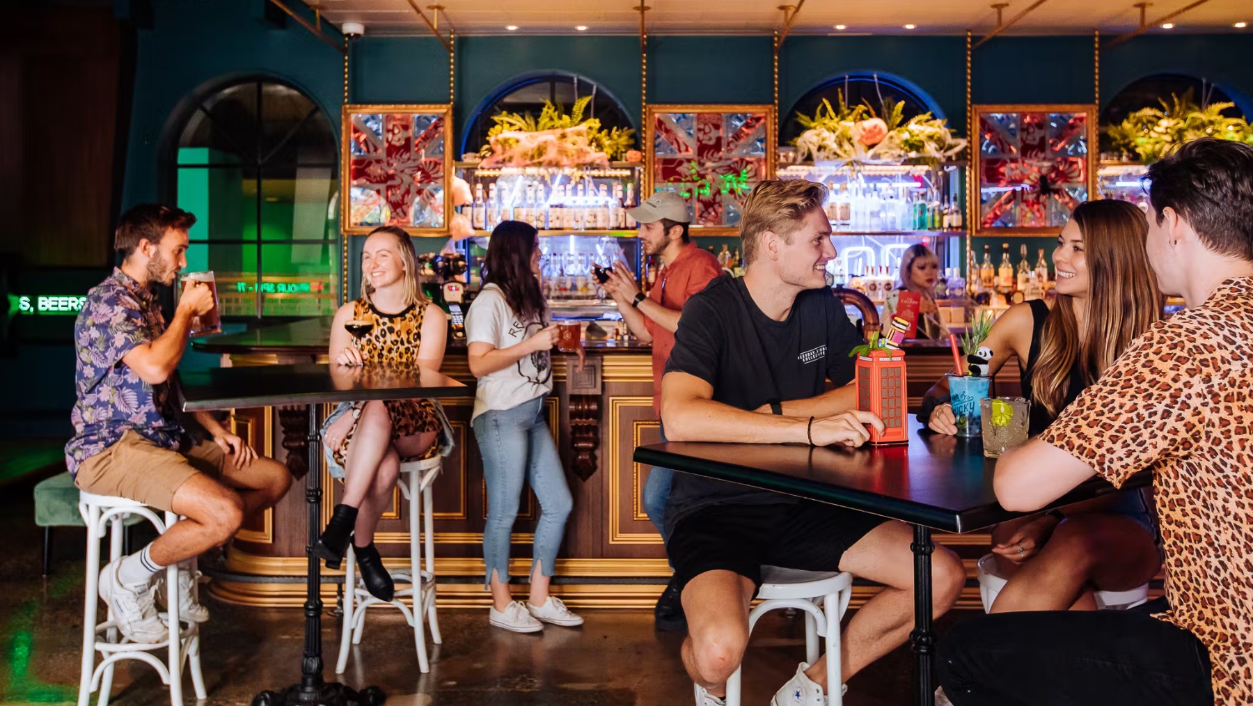 people at a bar in Alexandria sydney playing la di darts an interactive dart game by fun lab