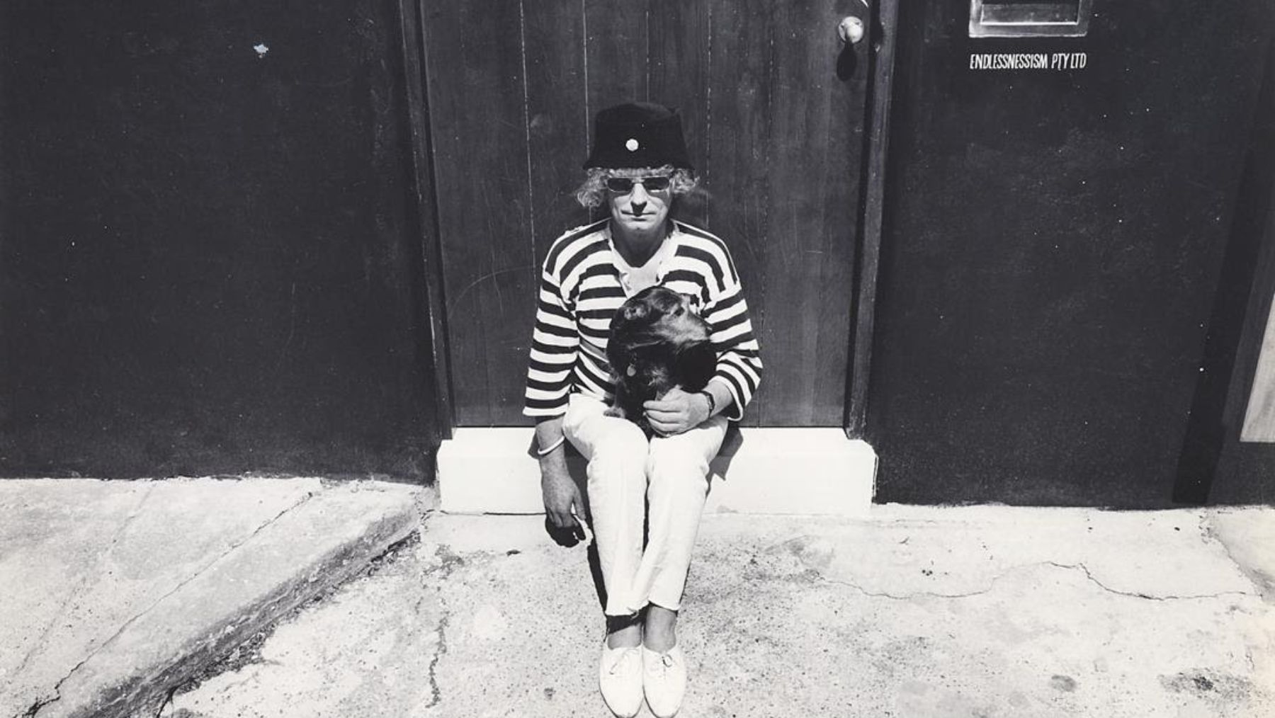Whiteley with pet terrier at his brett whiteley studio, 1988, photo © Jon Lewis