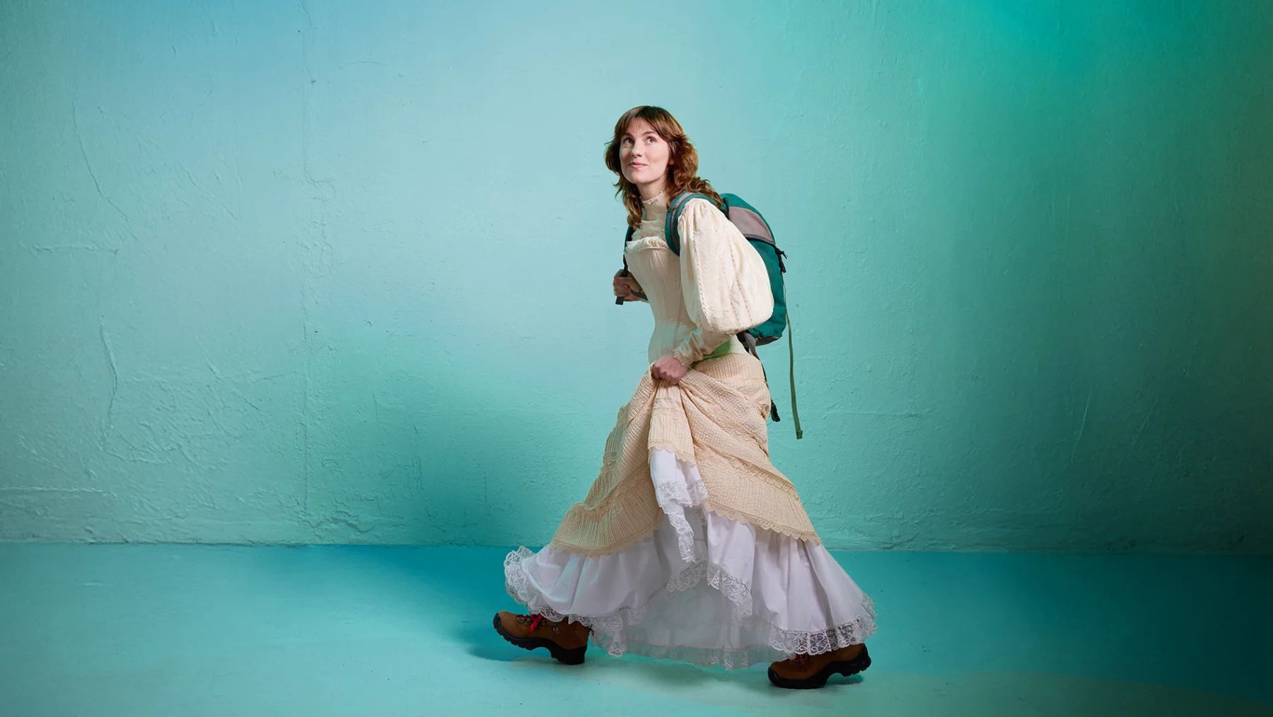 Woman in dress carrying backpack