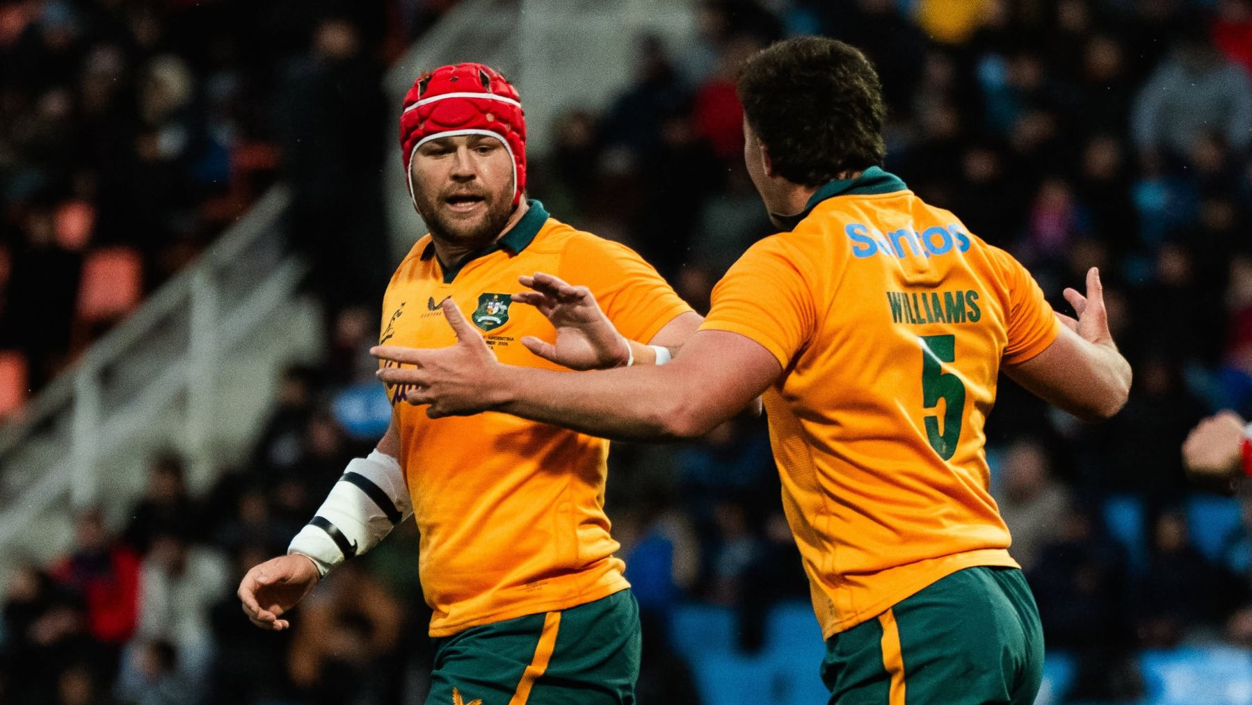 Two rugby players celebrating a play